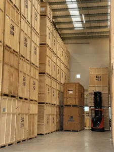 Containerised storage warehouse with stacked 35 to 50 sqft storage crates managed by Elite Moving